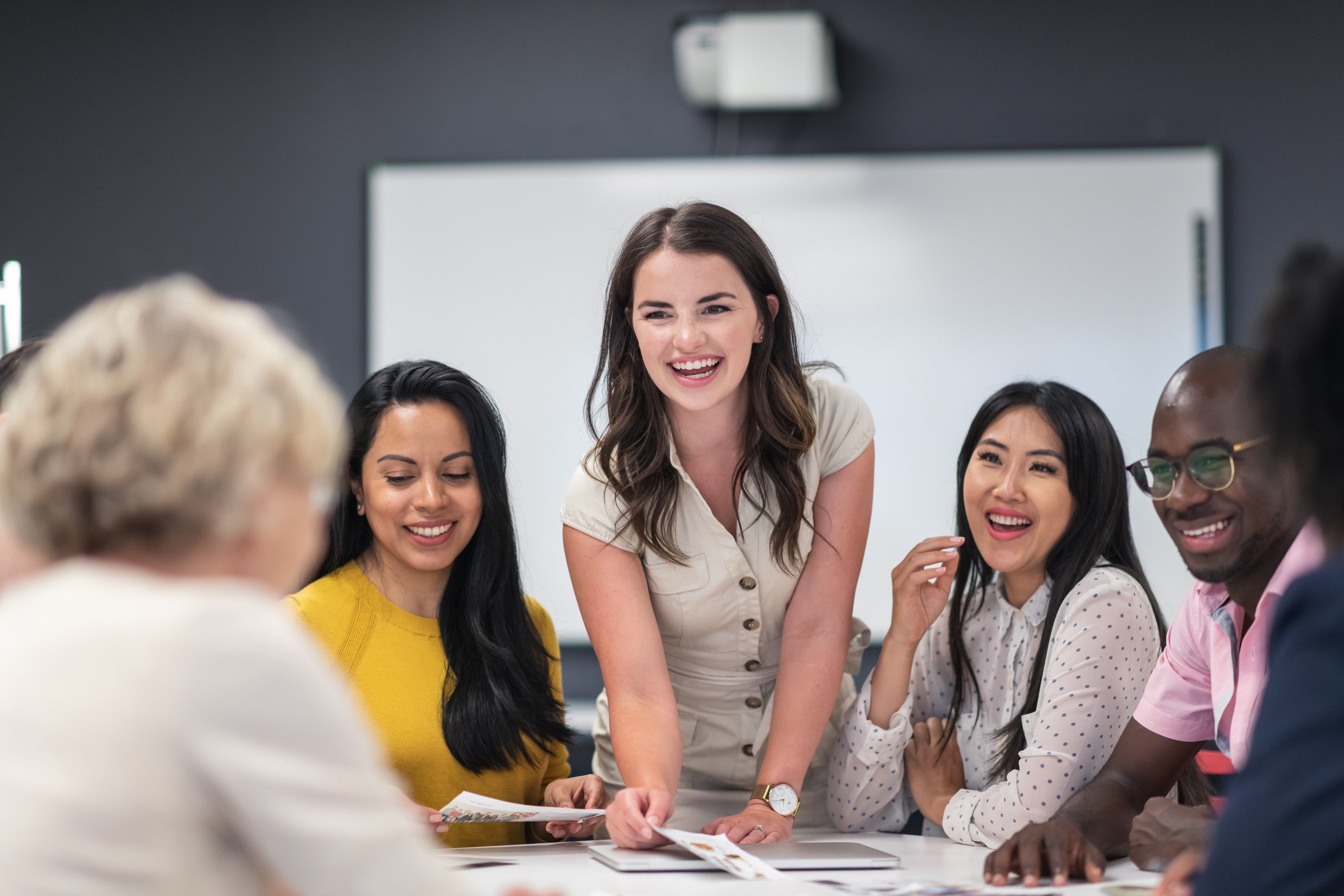 Successful female leader meeting with colleagues